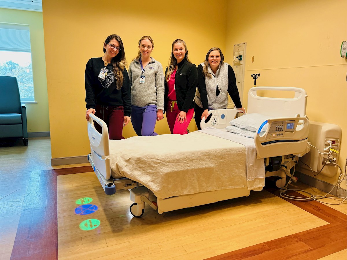 Nurses at South County Hospital pose with new Smart Bed, purchased with grant from the Champlin Foundation.