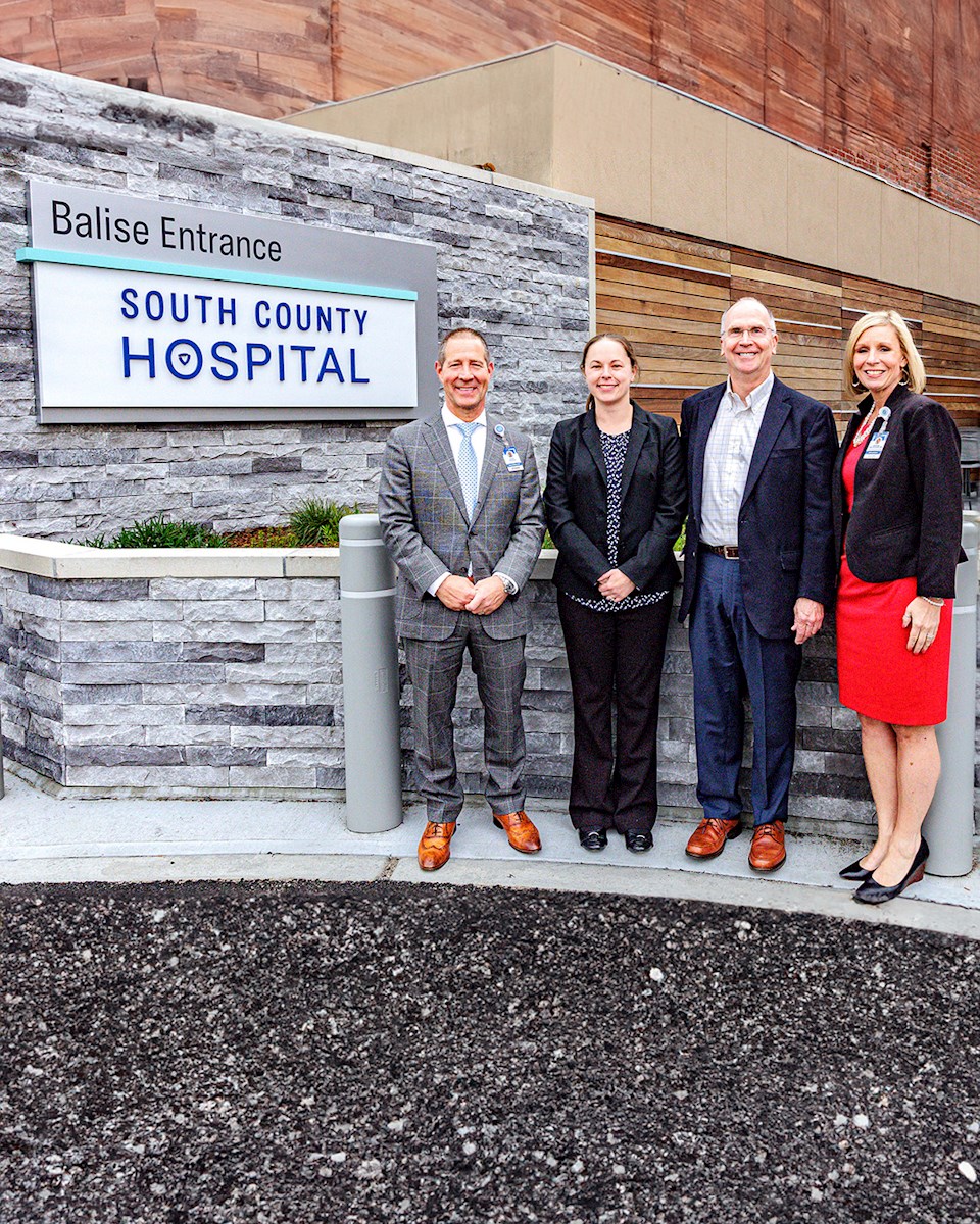 Jeb and Alex Balise stand with South County Health's President and CEO Aaron Robinson, and Christine Foisy, Chief Philanthropy Officer