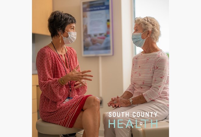 Patient speaks with caregiver at South County Health