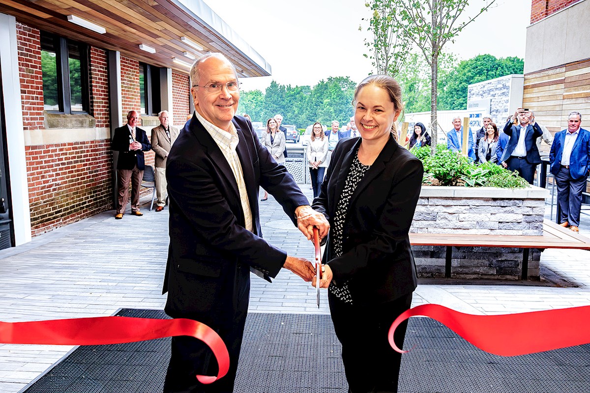 Jeb Balise and his daughter, Alex Balise cut the ribbon of the Balise Entrance at South County Hospital